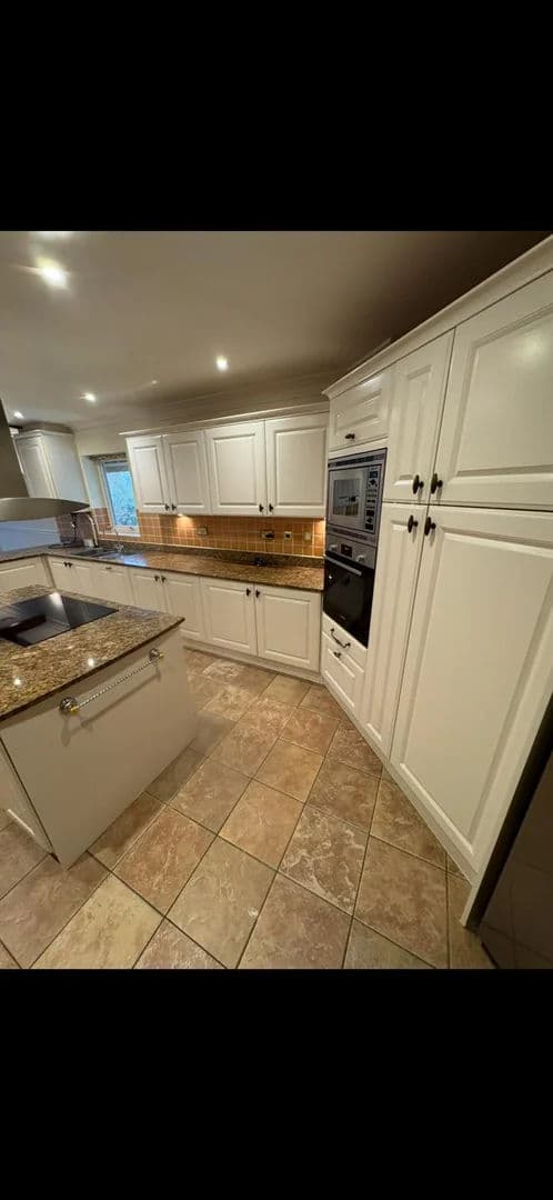 Kitchen cabinets repainted – after