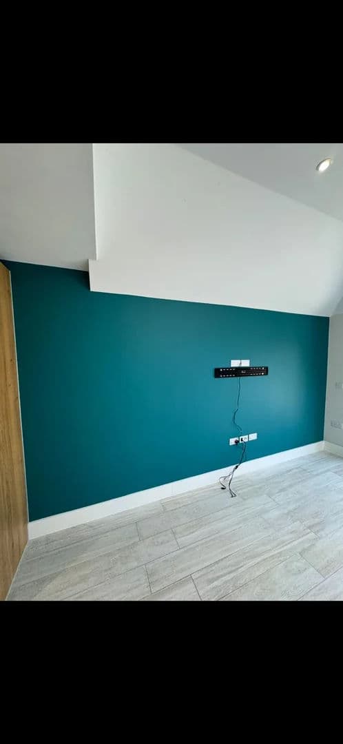 Bedroom plastered and painted teal – after